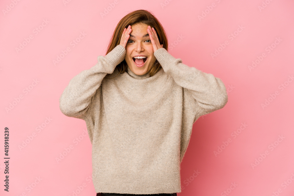Young skinny caucasian teenager girl having fun covering half of face with palm. Young skinny caucasian teenager girl having fun covering half of face with palm.