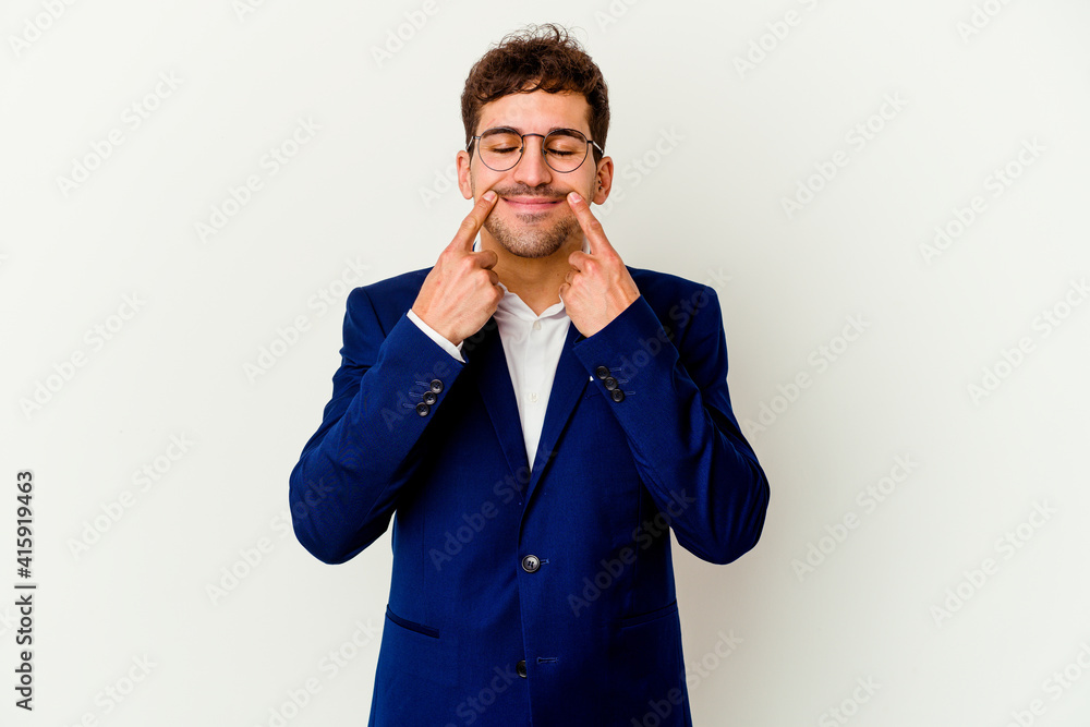 Young business caucasian man isolated on white background doubting between two options. Young business caucasian man isolated on white background doubting between two options.