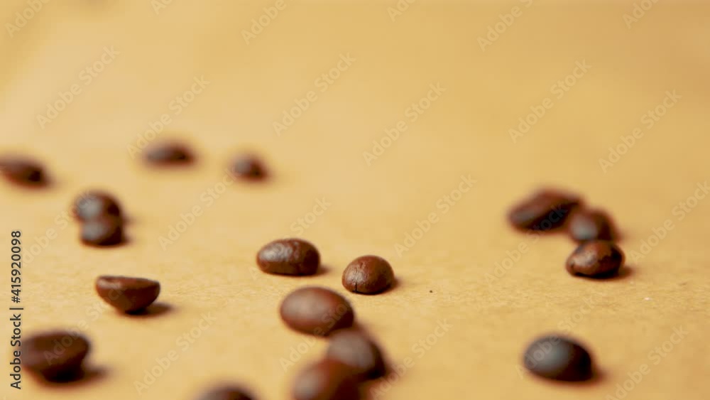 Coffee beans falling from above on old paper vintage look Coffee beans falling from above on old paper vintage look