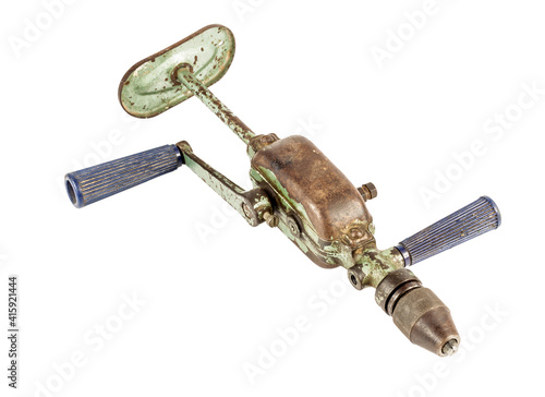 A vintage old manually operated hand drill. Isolated on white background