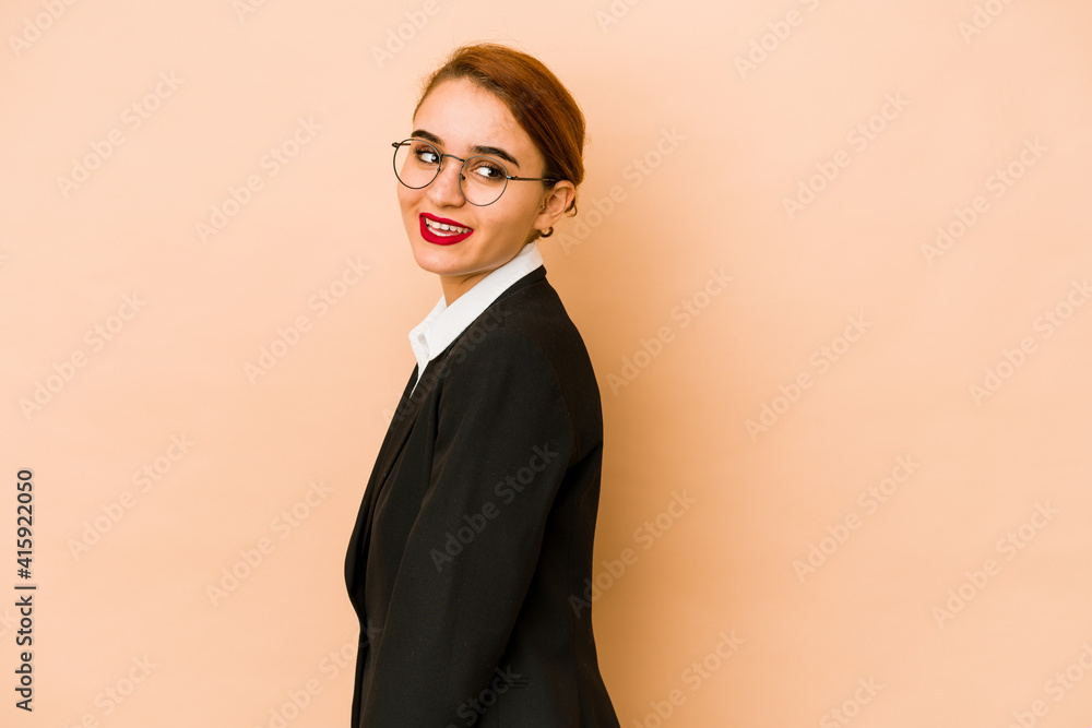 Young skinny caucasian business woman isolated looks aside smiling, cheerful and pleasant. Young skinny caucasian business woman isolated looks aside smiling, cheerful and pleasant.