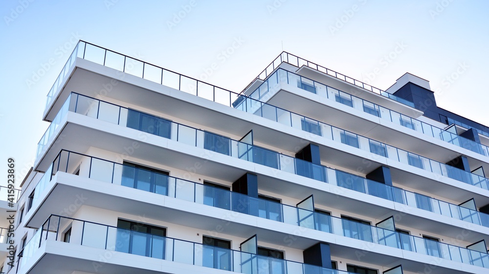 Condominium and apartment building with symmetrical modern architecture in the city downtown. Condominium and apartment building with symmetrical modern architecture in the city downtown.