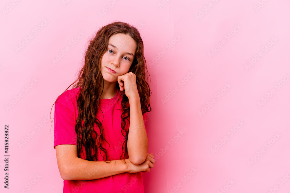 Little caucasian girl isolated on pink background who feels sad and pensive, looking at copy space. Little caucasian girl isolated on pink background who feels sad and pensive, looking at copy space.