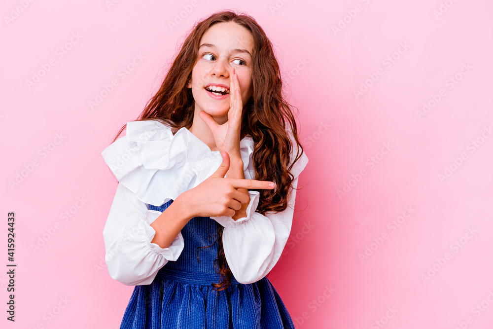 Little caucasian girl isolated on pink background saying a gossip, pointing to side reporting something. Little caucasian girl isolated on pink background saying a gossip, pointing to side reporting something.