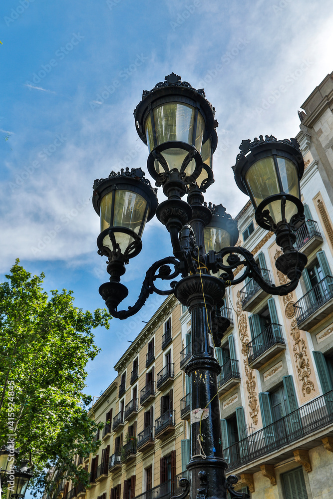 Spain, Barcelona. Light along the street.