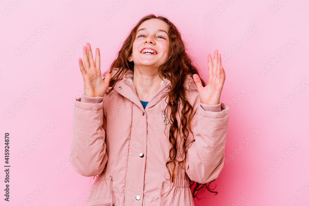 Little caucasian girl isolated on pink background laughs out loudly keeping hand on chest. Little caucasian girl isolated on pink background laughs out loudly keeping hand on chest.