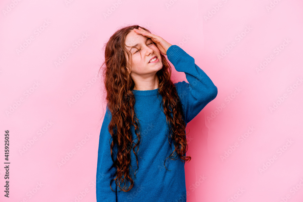 Little caucasian girl isolated on pink background forgetting something, slapping forehead with palm and closing eyes.