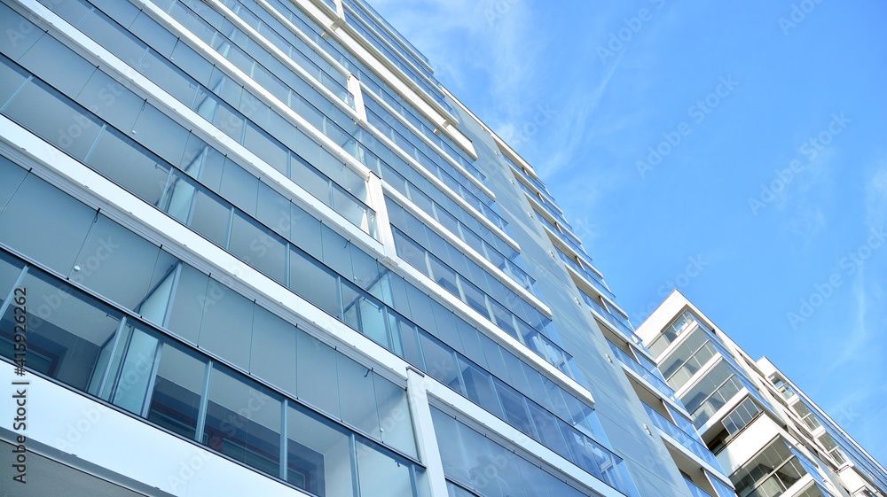Condominium and apartment building with symmetrical modern architecture in the city downtown. Condominium and apartment building with symmetrical modern architecture in the city downtown.