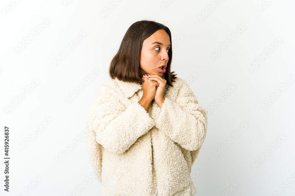 Young mixed race woman praying for luck, amazed and opening mouth looking to front. Young mixed race woman praying for luck, amazed and opening mouth looking to front.