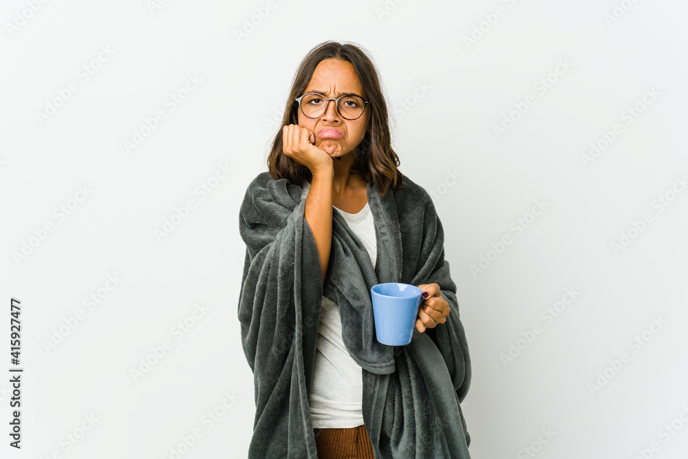 Young latin woman with blanket isolated on white background Young latin woman with blanket isolated on white background