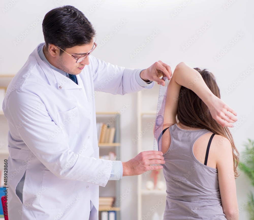 Fototapeta premium Doctor checking patients joint flexibility