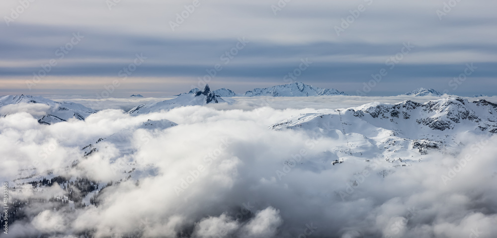 Beautiful Aerial Panoramic View of Whistler Mountain during a sunny winter day. Taken from Blackcomb Peak, Whistler, British Columbia, Canada. Canadian Nature Landscape Panorama