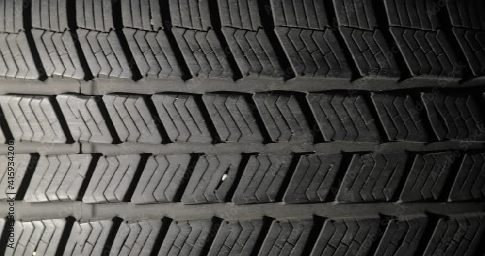 Spinning tire of a car slowing down to stope for vertical video Spinning tire of a car slowing down to stope for vertical video