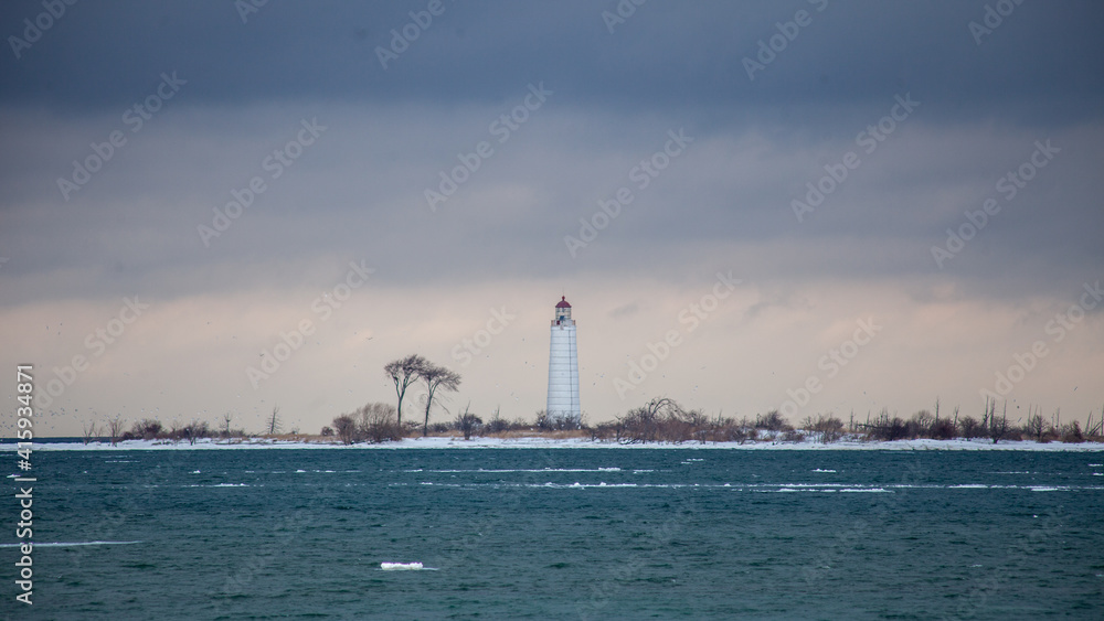 Obraz premium The Nottawasaga lighthouse is in southern Georgian Bay, Collingwood, and is in need of rebuilding to keep the structure stable. The lighthouse was a beacon for the town's shipbuilding history