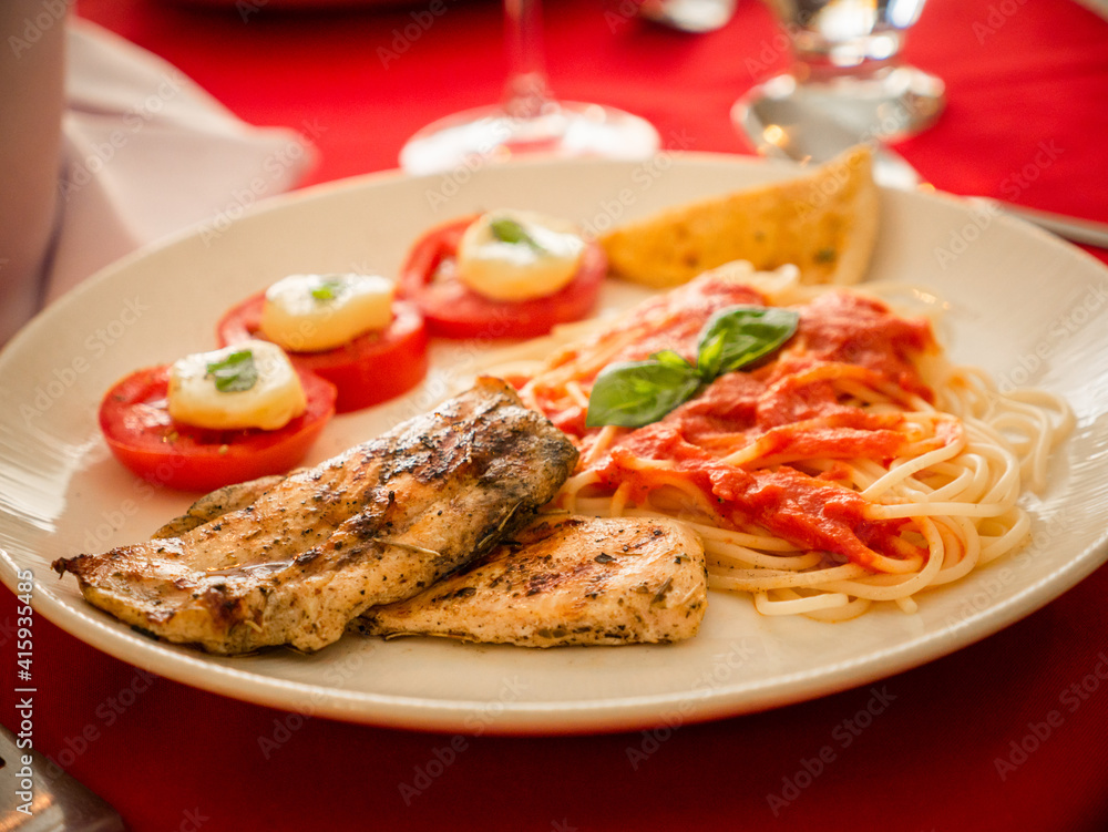 grilled steak with vegetables and pasta