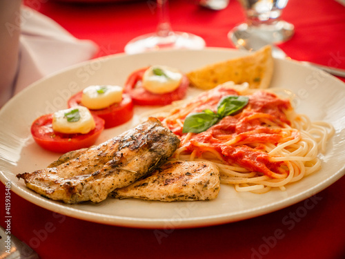 grilled steak with vegetables and pasta