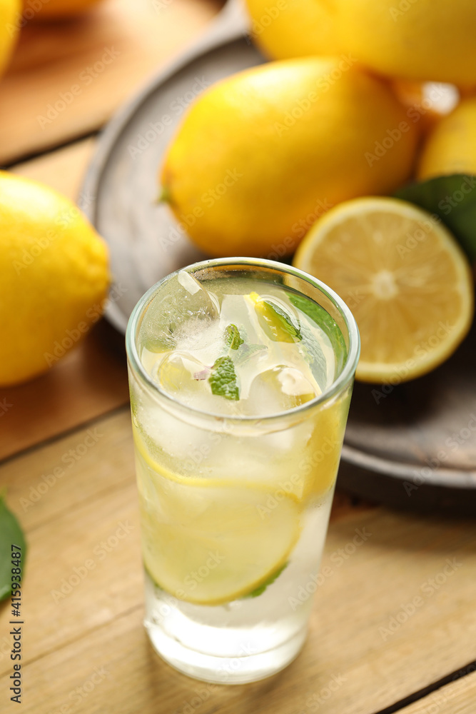 Cool freshly made lemonade and fruits on wooden table Cool freshly made lemonade and fruits on wooden table