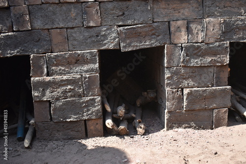 brick kiln.Brick making process .A burning traditional Indian clove clamp kiln with raw bricks