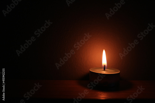 the candlelight in the dark room