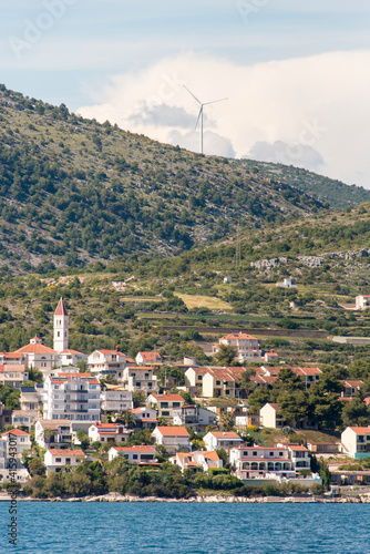 Croatia. Seget Vranjica on Dalmatian Coast near Trogir. Windmill turbine. photo