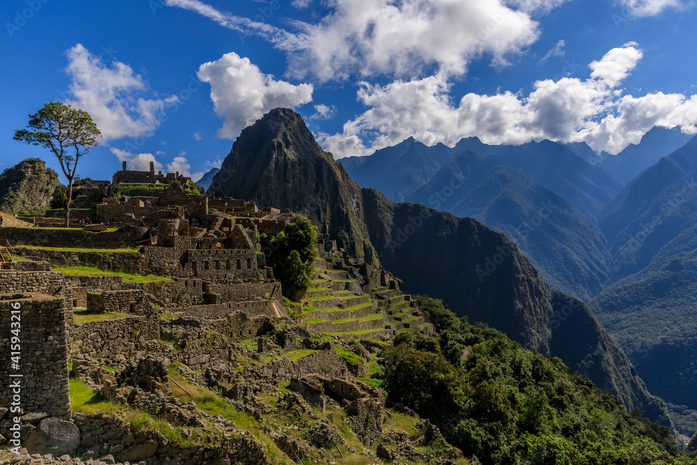 The ruins of Machu Picchu on a sunny day of June