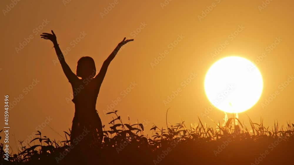Slow motion of silhouette happy woman dancing with sunset background. Slow motion of silhouette happy woman dancing with sunset background.