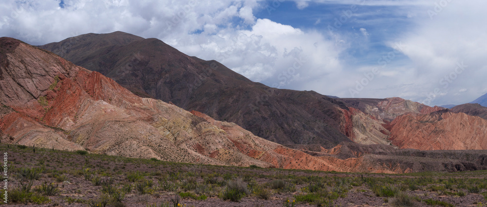 The Andes mountain range. Panorama view of the valley and colorful mountains under a beautiful sky.