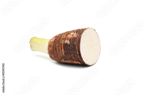 Taro root cut in half on white isolated background with clipping path