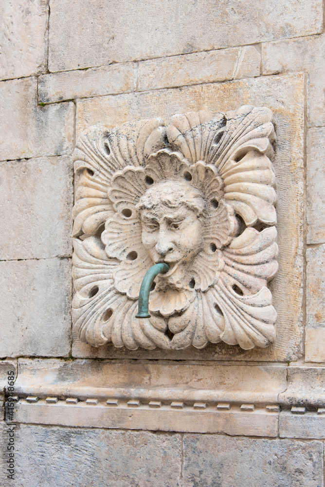 Croatia, Dubrovnik. City fountains have spouts. Potable water to be collected.
