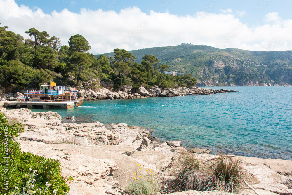 Croatia, Dubrovnik, Lokrum Island. Ferry dock in protected bay. View back to mainland.