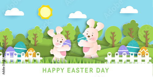 Easter day card with cute rabbiits and easter eggs. © Nattapohn