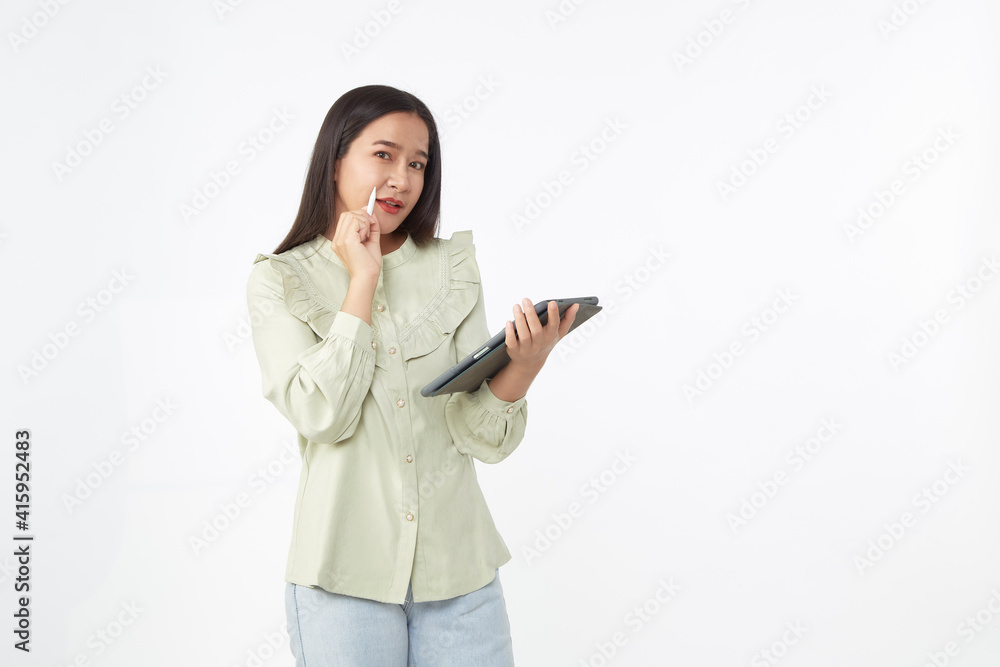 Beautiful young woman holding digital tablet and looking at camera with smile while standing. Wireless technology. Beautiful young woman holding digital tablet and looking at camera with smile while standing. Wireless technology.