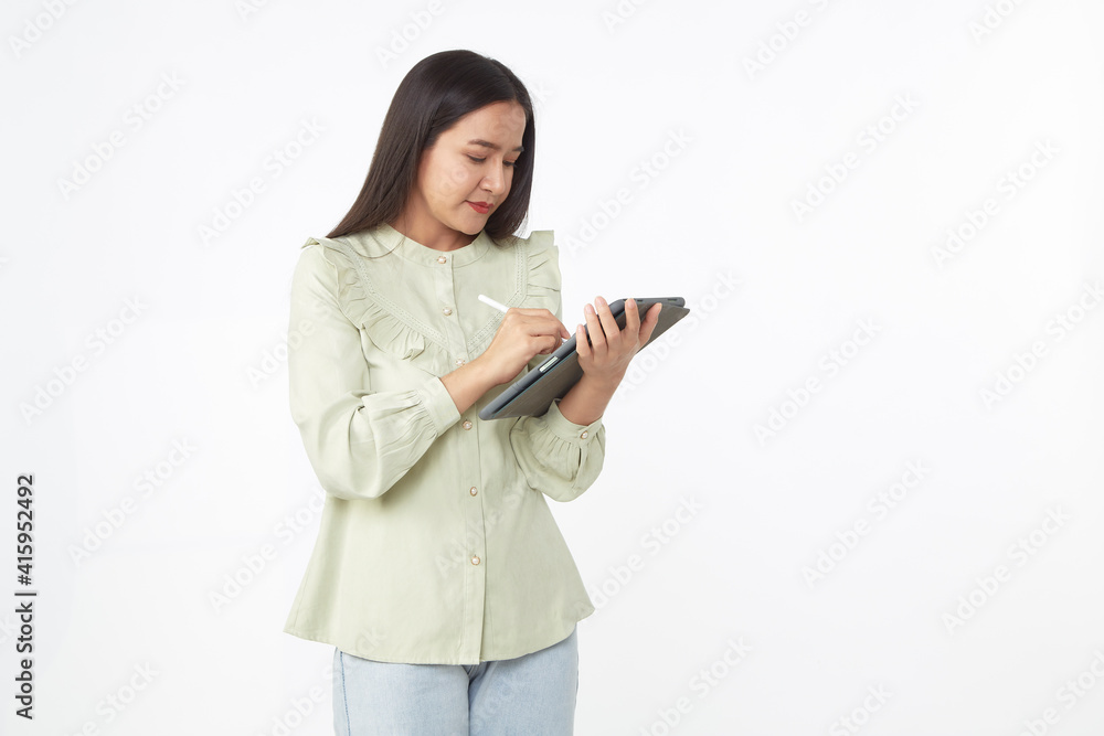 Beautiful young woman holding digital tablet and looking at camera with smile while standing. Wireless technology. Beautiful young woman holding digital tablet and looking at camera with smile while standing. Wireless technology.