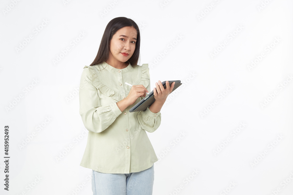 Beautiful young woman holding digital tablet and looking at camera with smile while standing. Wireless technology. Beautiful young woman holding digital tablet and looking at camera with smile while standing. Wireless technology.