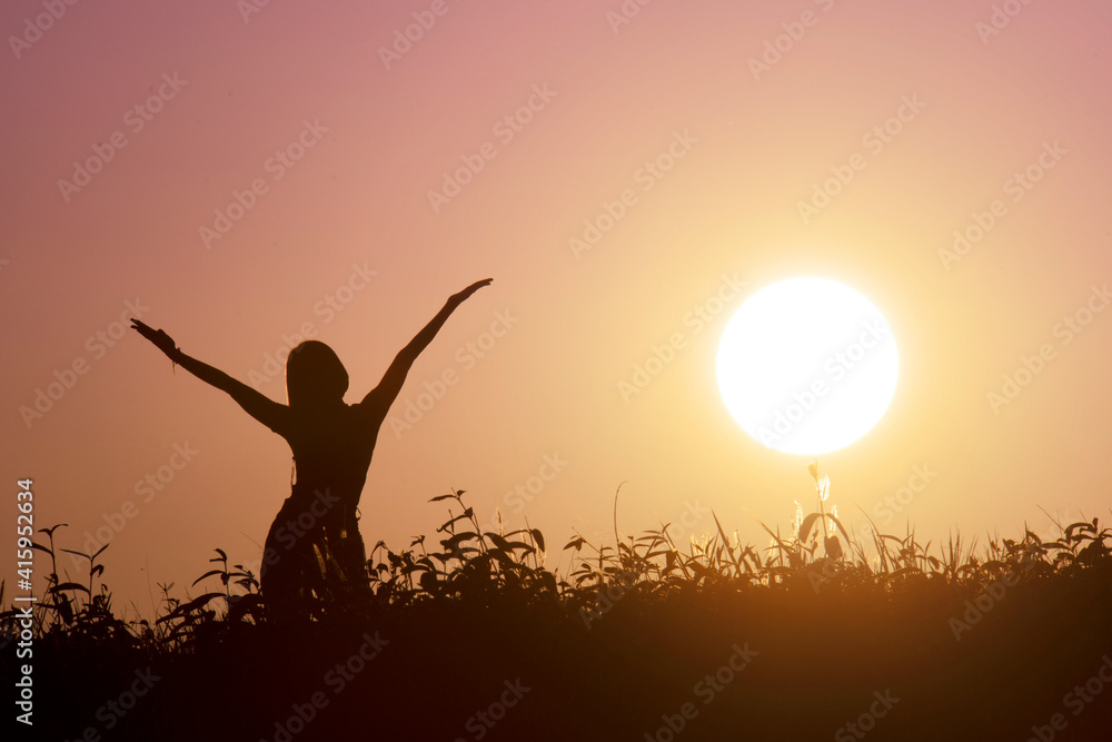 Happy woman open arms with sun background Happy woman open arms with sun background