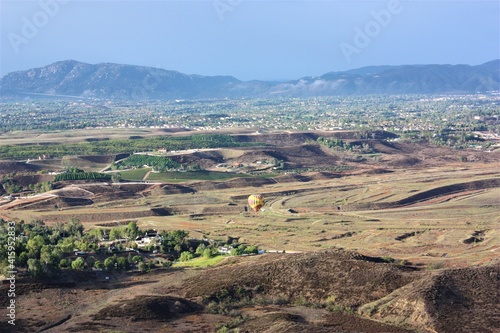 Colorful hot air balloon flying on blue sky background at Temecula in California. aerial view - 気球 カリフォルニア テメキュラ