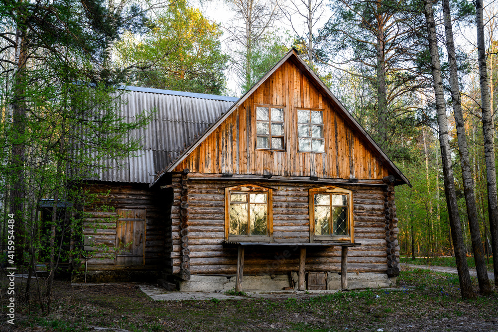 An abandoned wooden hut in the Siberian taiga An abandoned wooden hut in the Siberian taiga