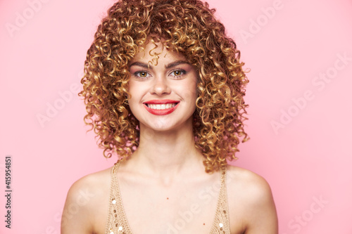 Blond woman Beautiful smile curly hair model dress sequins bright makeup 