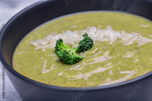 Fresh broccoli soup on bowl. Long banner format. Vegetarian and diet food