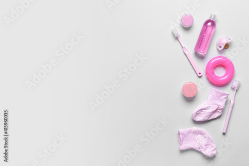 Set of bath accessories for baby on light background