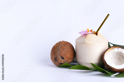 Fresh and ripe coconuts on white background