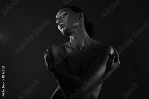 Female silhouette, beautiful woman in dark