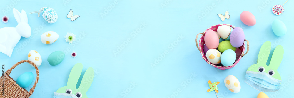 Cute bunny with medical mask. Top view, Flat lay. Coronavirus prevention concept Cute bunny with medical mask. Top view, Flat lay. Coronavirus prevention concept
