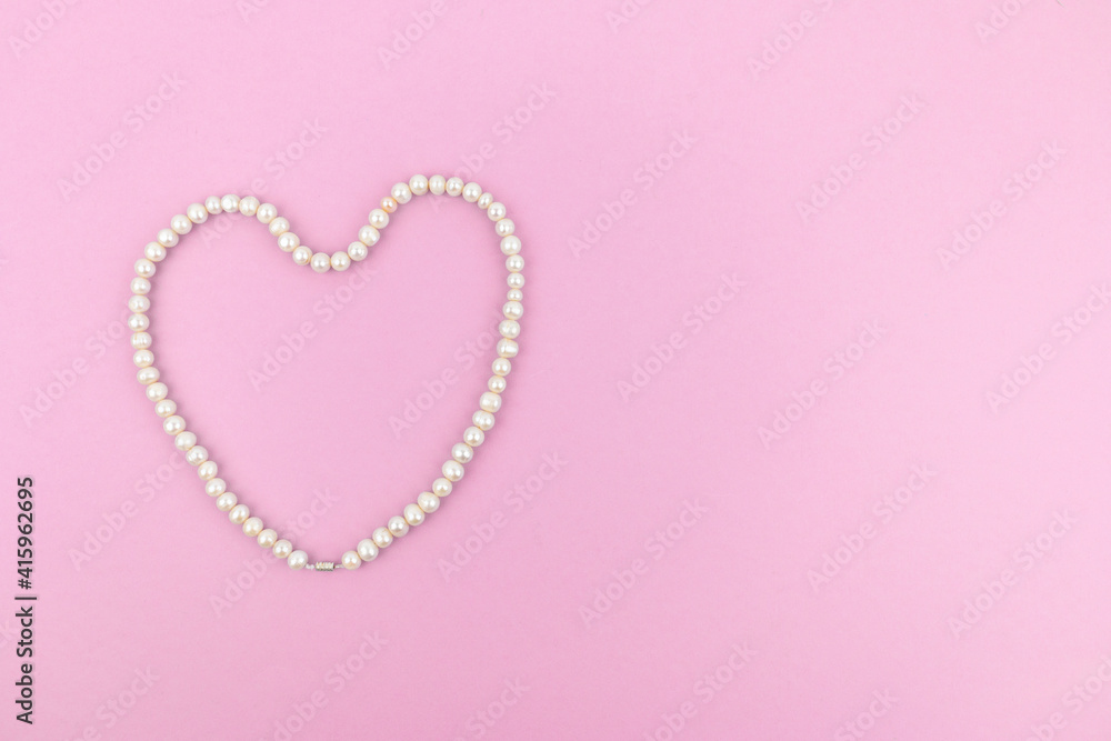 Pearl heart on a pink background. Space for text. Banner, card, invitation Pearl heart on a pink background. Space for text. Banner, card, invitation