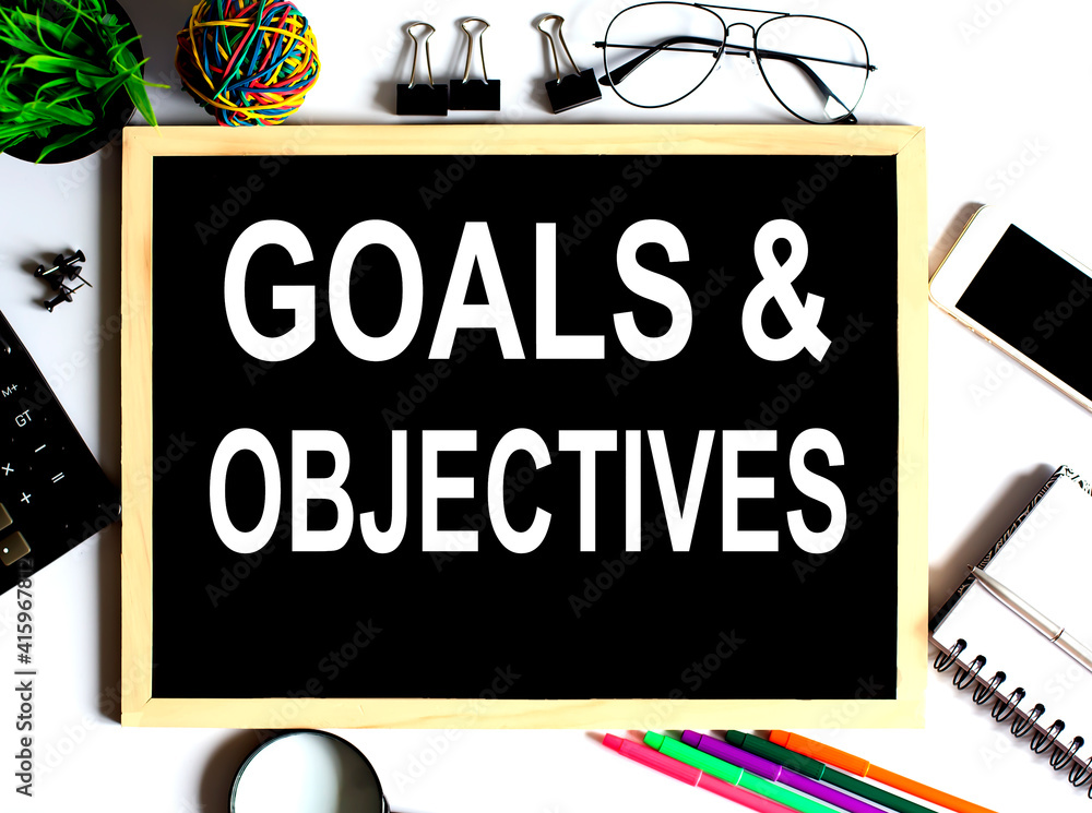 GOALS and OBJECTIVES Concept on the drawing board with office tools