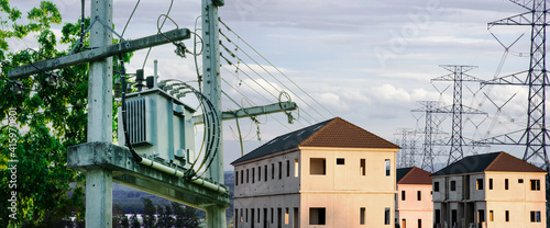 Distribution high voltage transformer for power transmission to industry with sunset sky background,High voltage electricity infrastructure design to home electric lighting utility