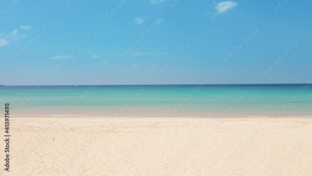 Phuket Thailand beach sea. Landscape view of beach sea and sand in summer sun. Beach space area background. At Patong beach, Phuket, Thailand. On 16 jan 2021. 4K UHD Video clip Phuket Thailand beach sea. Landscape view of beach sea and sand in summer sun. Beach space area background. At Patong beach, Phuket, Thailand. On 16 jan 2021. 4K UHD Video clip
