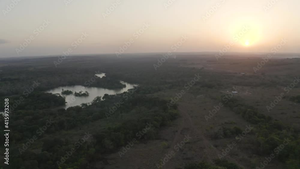 Sunset over subtropical river system in savanna plain in Guyana Sunset over subtropical river system in savanna plain in Guyana