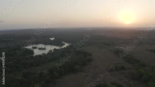 Sunset over subtropical river system in savanna plain in Guyana 