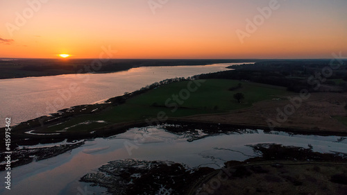 View of the River Orwell from a drone at sunset in Suffolk, UK